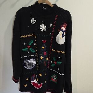 Festive Ohi Black Turtleneck Sweater with Holiday Motifs